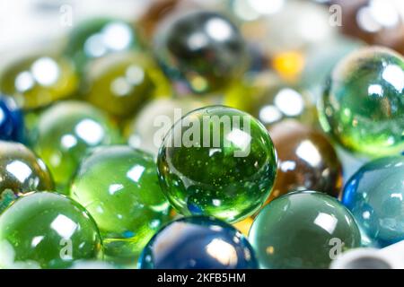 Lots of green glass beads, close-up balls. Stock Photo