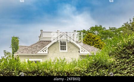 top of an old house rising above the privet Stock Photo