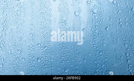 Water Drops On Blue Background. Stock Photo