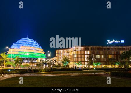 Kigali, Rwanda - August 19 2022: Kigali Convention Centre at night, lit up in the colors of the Rwandan flag. The facility is designed to host a varie Stock Photo