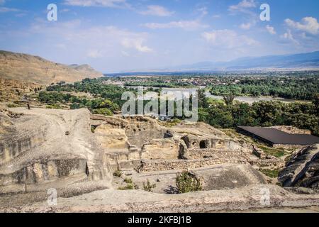 Looking out over the Mtkvari River from prehistoric Uplistsikhe cave town built on the cliffs near Gori Georgia. Stock Photo