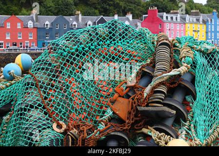 Colourful Fishing Nets in Front of a Colourful House Row, Tobermory, Mull, Isle of Mull, Hebrides, Outer Hebrides, Western Isles, Scotland Stock Photo
