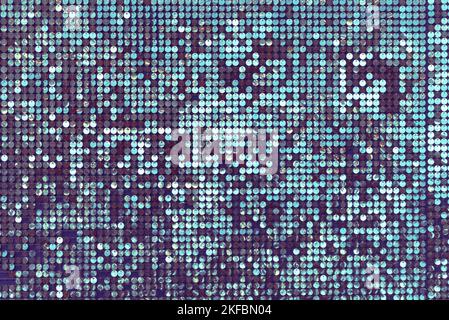 Background filled with sequins. Purple and green shades Stock Photo