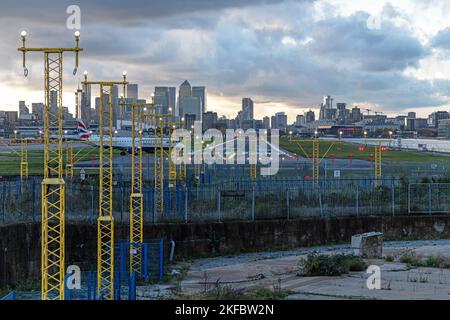 A British Airways Embraer ERJ-190 taxis towards the end of the runway at London City Airport. Stock Photo
