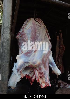 hanging pieces of meat in the butchers shop , butcher's shops, meat stores, meat markets or butcheries Stock Photo