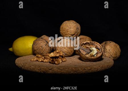 Walnuts on a black matte background. Stock Photo