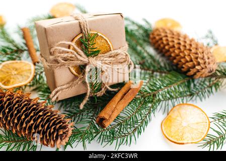 Gift box with natural Christmas decoration. New Year gift. Stock Photo