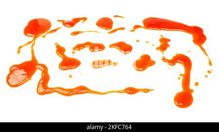 Orange sauce splashes isolated on white a background. Top view. Stock Photo