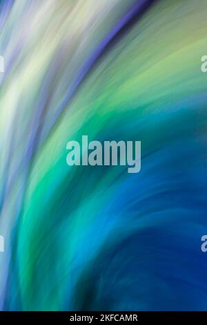 Vertical beautiful abstract multi-colored background in cold colors with green, blue, lilac waves with a gradient. Backdrop Stock Photo