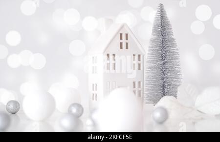 Christmas composition. Christmas balls white and silver, decorative house, christmas tree on a white background Stock Photo