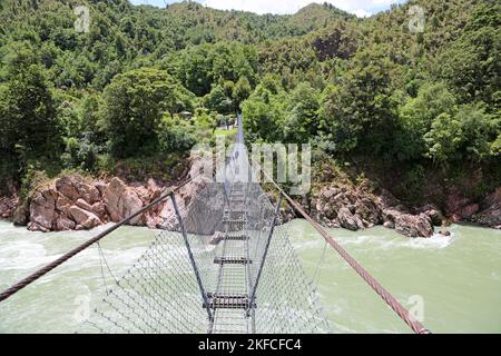 Walking Buller gorge swing bridge - New Zealand Stock Photo