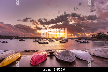 The reflection of the cloudy blue sky and the water is calm in Watsons Bay, Sydney, Australia. Stock Photo