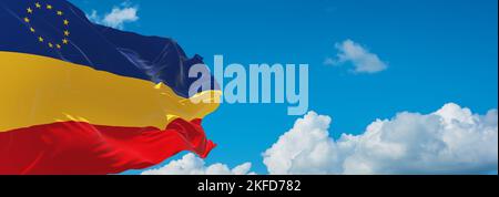 flag of Daco-Romance peoples Serbian Romanians at cloudy sky background, panoramic view. flag representing ethnic group or culture, regional authoriti Stock Photo