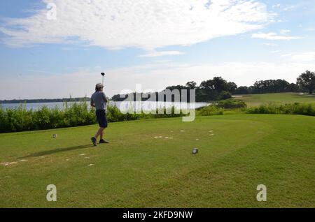 Dave Klemm tees off on hole 8 of Bayou Course on Naval Air Station ...