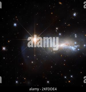 Telescope image captures a galaxy and a star named Lacerta Star. Twinkling stars in outer space. Elements of this image furnished by NASA. Stock Photo