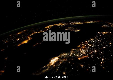 Aerial view, cities light up the night view from space. Mediterranean Sea from north Africa to southern Europe. Elements of image furnished by NASA. Stock Photo