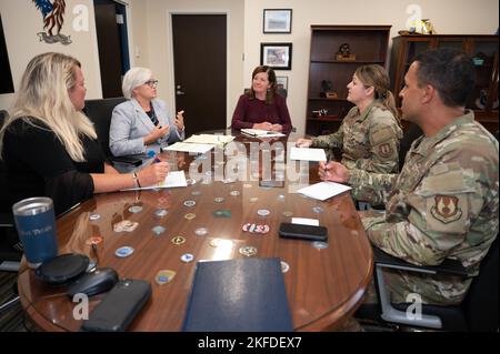 Dr. Becky McFall, second from left, Lincoln, Mass., Public School superintendent, speaks to Col. Taona Enriquez, second from right, installation commander, during a meet and greet at Hanscom Air Force Base, Mass., Sept. 9, while Lynn Fagan, from left, principal for Early Childhood Programs in Lincoln, Laurel Wironen, Hanscom AFB school liaison officer, and Chief Master Sgt. Alan Weary, installation command chief, look on. The Hanscom Primary and Middle schools are part of the Lincoln Public School District. Stock Photo