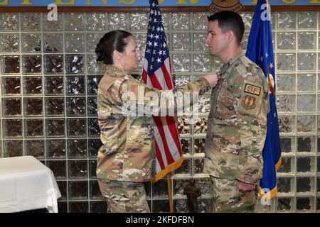 ROBINS AIR FORCE BASE, Ga. – Col. Lindsay Droz, 78th Air Base Wing commander, left, decorates Master Sgt. Mathue B. Snow, 78th Security Forces Squadron, with the Bronze Star Medal at Robins Air Force Base, Georgia, Sept. 9, 2022. Snow was decorated for actions during the Jan. 5th, 2020, complex attack on Manda Bay, Kenya, where one American Soldier and two Department of Defense civilian contractors lost their lives, and six U.S. aircraft and one Kenyan aircraft were destroyed. Stock Photo