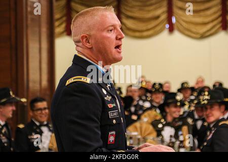 Capt. Martin Delaney, provost marshal of 2nd Stryker Brigade Combat Team, 4th Infantry Division, speaks as the host during a dining in at Ft. Carson, Colo., Sept. 9. The brigade held the dining in to celebrate its past, build a more cohesive team, and provide a social atmosphere for camaraderie and fun.  U.S. Army photo by Maj. Jason Elmore. Stock Photo