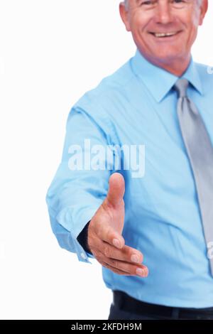 Business man extending hand to shake. Happy mature business man extending hand to shake over white background. Stock Photo