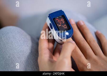 African Hand Pulse Heart Rate And Oximeter Stock Photo