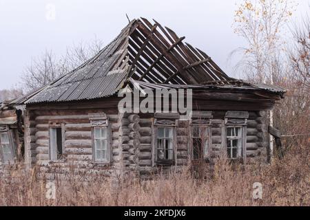 Old destroyed wooden house in the village Stock Photo