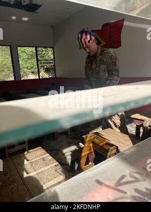 U.S. Air Force Tech. Sgt. Jesse Marquez, lead electrical engineer, inspects a classroom at a school site during renovations in support of Pacific Angel 22-4 in Baucau, Timor-Leste, Sept. 10, 2022. The operation is scheduled for Sept. 12-17 and will focus on capacity building through health service outreach, subject matter expert exchanges and civil engineer renovation projects. CE,HADR,INDOPACOM,PACAF,Pacific Angel,Pacific Angel 22-4, Stock Photo