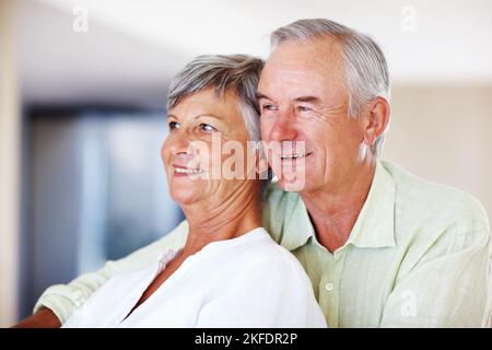 Mature couple spending time together at home. Closeup of loving mature couple spending tine together at home. Stock Photo