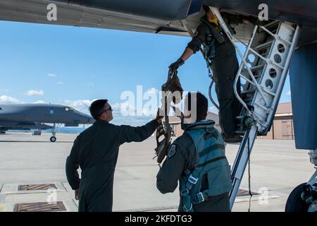 Aircrew assigned to the 37th Bomb Squadron unload equipment from a B-1B Lancer at Ellsworth Air Force Base, S.D., upon completion of a CONUS-to-CONUS (C2C) mission to the Indo-Pacific region, Sept. 10, 2022. A C2C mission contributes to joint force lethality and deters aggression in the Indo-Pacific by demonstrating the United States Air Force's ability to operate anywhere in the world at any time in support of the National Defense Strategy. Stock Photo