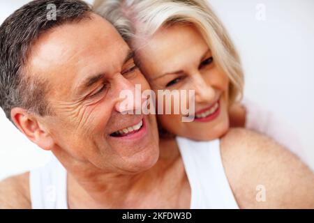 Romantic mature couple spending time together. Macro view of a romantic mature couple spending time together. Stock Photo