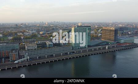 A drone photo aerial view of the Ij dockland and Mövenpick Hotel, Amsterdam,city centre Netherlands Stock Photo