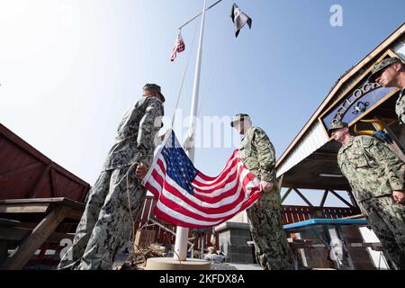 CAMP LEMONNIER, Djibouti (Sept. 11, 2022) During a ceremony this morning at Camp Lemonnier, Djibouti (CLDJ) the United States Flag was lowered to half-staff in order remember the 2,977 victims of the terrorist attacks on our nation that occurred on 11 September 2001.  Camp Lemonnier's leadership and Chief's Mess wanted to take the opportunity to reflect on the victims of this attack as well as those who served and gave the ultimate sacrifice supporting the Global War on Terrorism. As Americans, we chose to commemorate this day with act of service and remembrance. CLDJ serves as an expeditionar Stock Photo