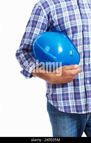 Architect holding protective helmet. Closeup of architect holding protective helmet over white background. Stock Photo