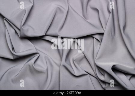 Crumpled silky gray fabric as background Stock Photo
