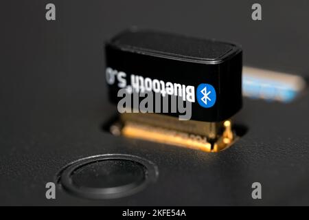 Close-up shot of wireless usb bluetooth on computer case. Stock Photo
