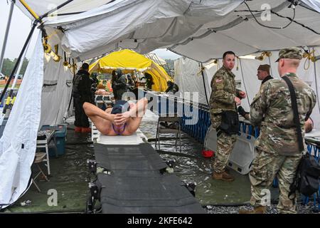 New York National Guardsman of the 152nd Engineer Battalion practice decontaminating casualties as part of a Homeland Response Force validation exercise at Fort Indiantown Gap, PA on September 11, 2022.  The Soldiers were rehearsing the decontamination of casualties who might have Chemical, Biological, Radiological or Nuclear (CBRN) contaminants on them in the aftermath of a manmade or natural disaster. (New York National Guard photo by SSG Matthew Gunther) Stock Photo