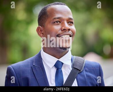 Happy black business man in the city, professional entrepreneur commute to work and outdoor in park. Young african lawyer in corporate suit, vision Stock Photo