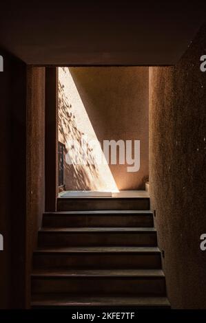 Walkway up staircase in natural soil wall with sunlight Stock Photo