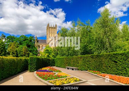 A colourful herbaceous border in Bishop Peter's Garden in a corner of the Bishop's Palace grounds in Wells, Somerset, England, UK Stock Photo