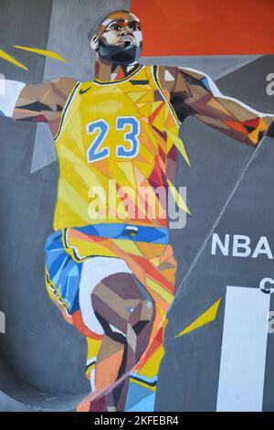 A painted mural of a dunking NBA basketball Los Angeles Laker great Lebron James. On a  road underpass concrete support in Astana, Nur Sultan, Kazakhs Stock Photo