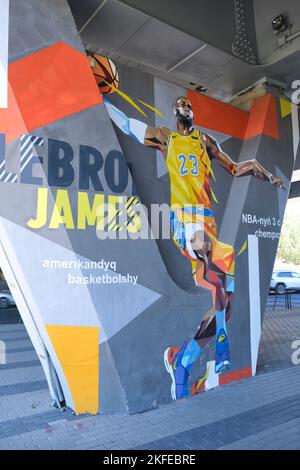 A painted mural of a dunking NBA basketball Los Angeles Laker great Lebron James. On a  road underpass concrete support in Astana, Nur Sultan, Kazakhs Stock Photo