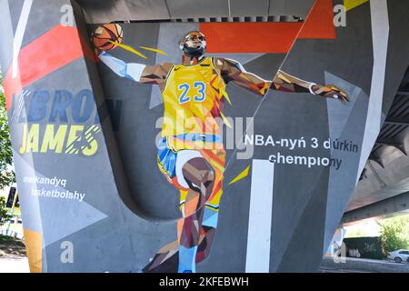 A painted mural of a dunking NBA basketball Los Angeles Laker great Lebron James. On a  road underpass concrete support in Astana, Nur Sultan, Kazakhs Stock Photo