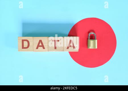 Data security and privacy protection concept. Data text on wooden blocks with metal padlock. Stock Photo
