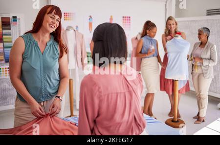 Creative startup, teamwork and fashion designer team together for planning, ideas and inspiration while talking fabric and textile. Tailor and manager Stock Photo