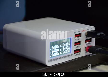 USB charger, multi-port connector, white charger Stock Photo