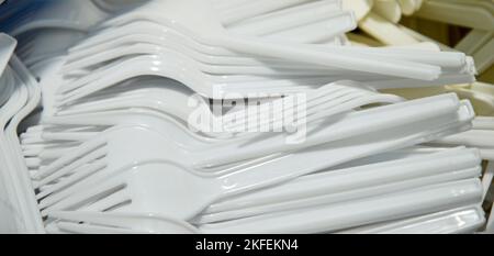 Picture of stacked white plastic forks Stock Photo