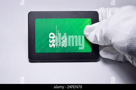 Close-up photo of 2.5" SSD hard drive, empty on white background. Stock Photo