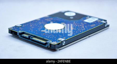 Close-up view of 2.5 inch hard drive seen from the side. and empty on a white background Stock Photo