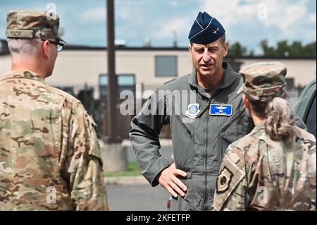 U.S. Air Force Maj. Gen. Corey Martin, 18th Air Force commander, is greeted by Col. Elizabeth Hanson, 305th Air Mobility Wing commander, and Col. Timothy Mach, 305th AMW vice commander, on Joint Base McGuire-Dix-Lakehurst, N.J., Sept. 13, 2022. Martin visited Joint Base MDL to gain insight on how the 305th AMW is innovating the aerial port and flightline, as well as creating and implementing Mobility Air Force Force Generation and Multi-Capable Airmen concepts. 18 AF,18th Air Force,305th AMW,DV visit,INNOVATION,MAFFORGEN, Stock Photo