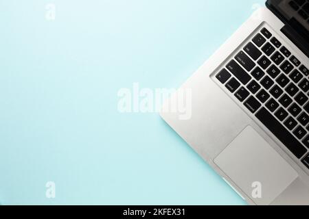 Leptop on the working blue table. Stock Photo